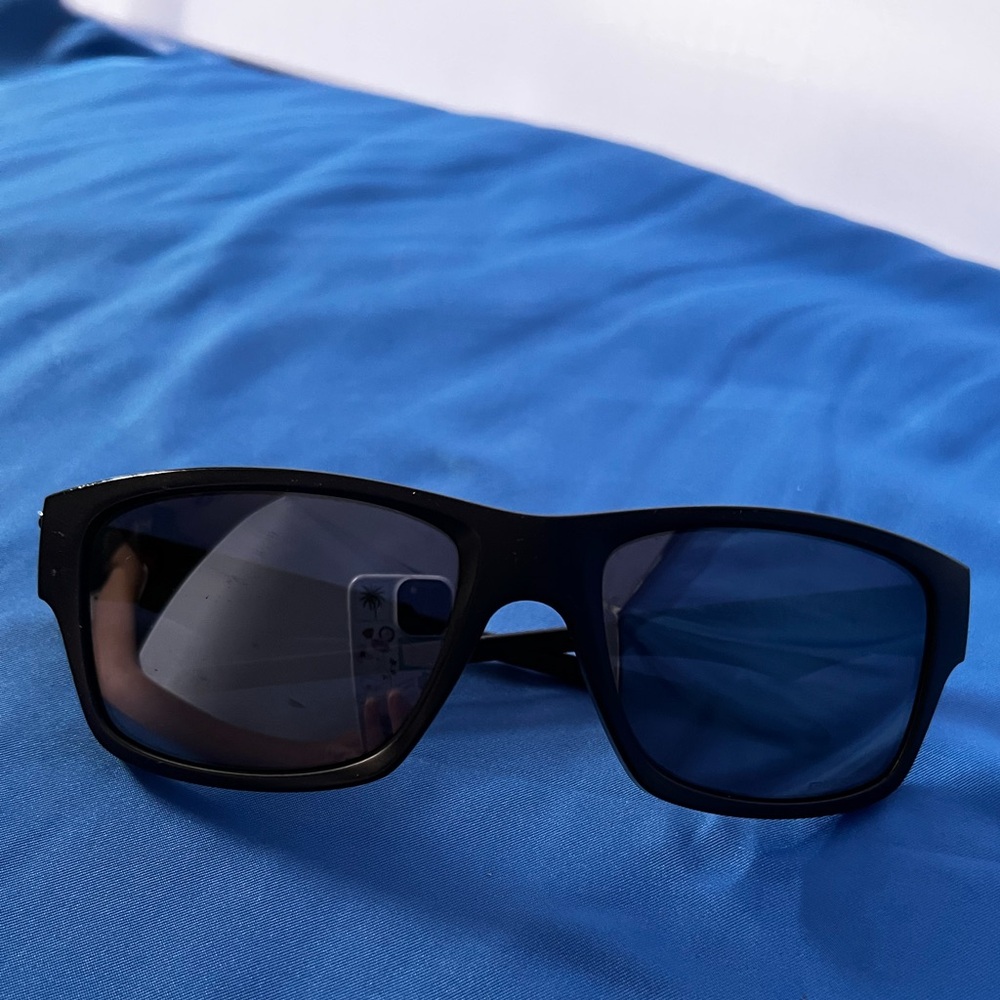 Oakley Classic Black Sunglasses with American Flag design on O of Oakley